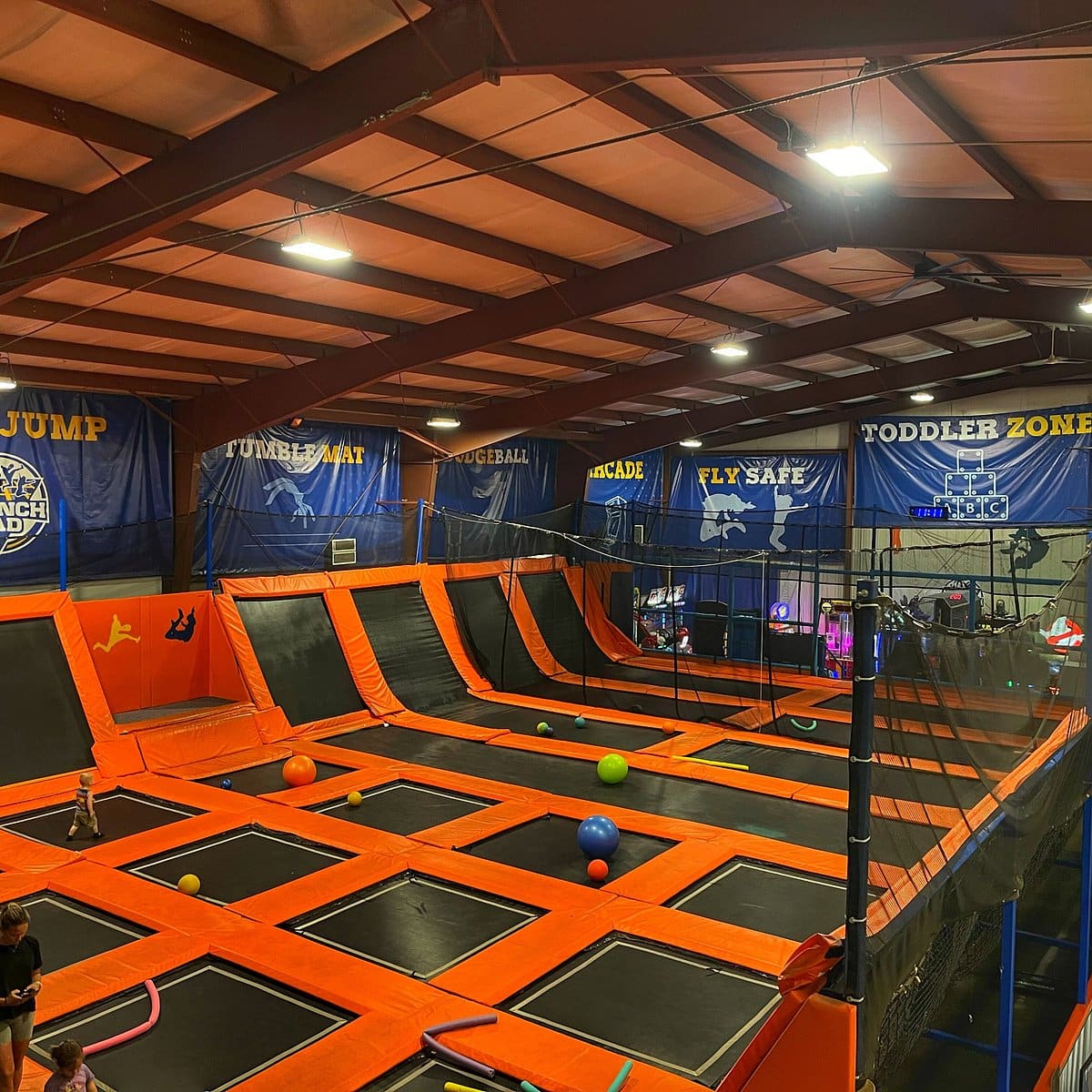 Wall-to-wall free-jump trampoline zone