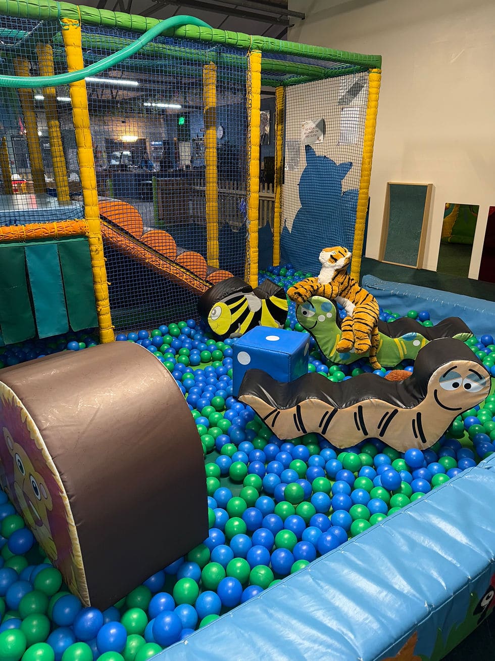 Toddler soft play area with ball pit toys