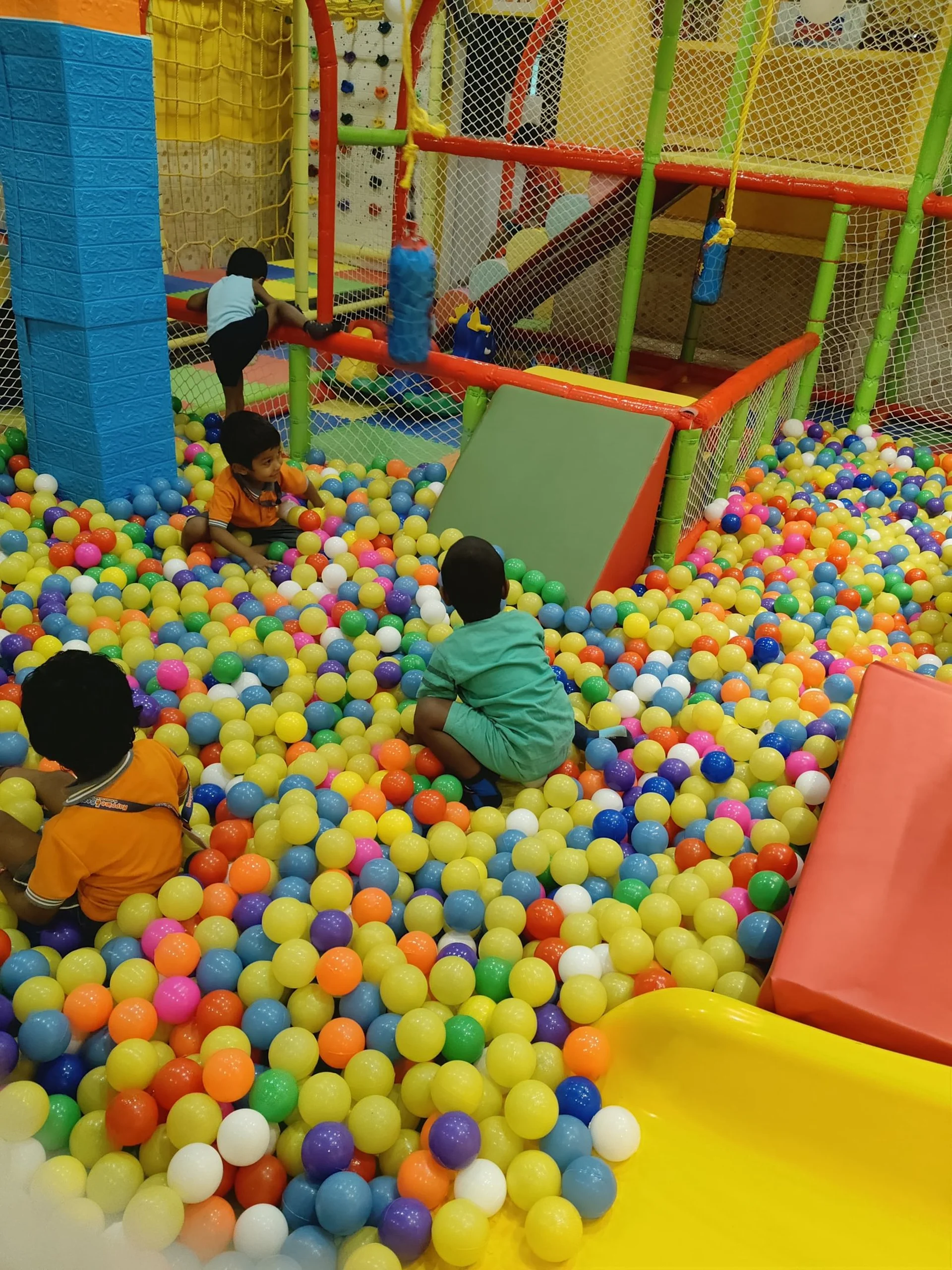 Kids celebrating a birthday party with balloons at Alias Park